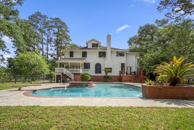 pool featuring stairs and fence