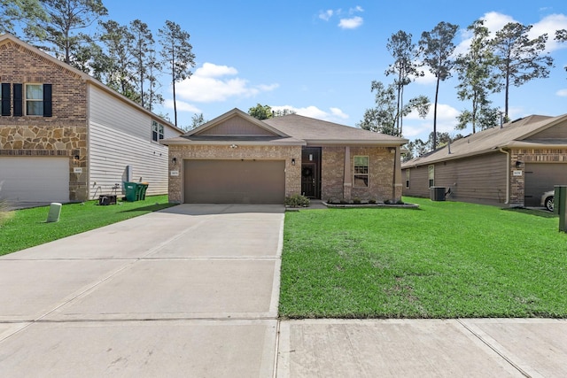 view of front of house featuring central AC, driveway, a front yard, brick siding, and an attached garage