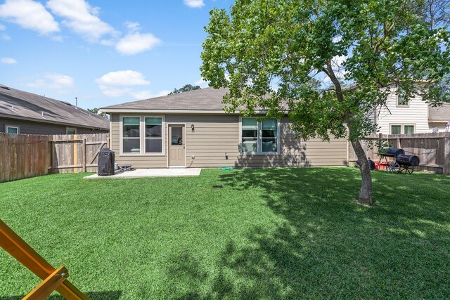 rear view of property with a patio area