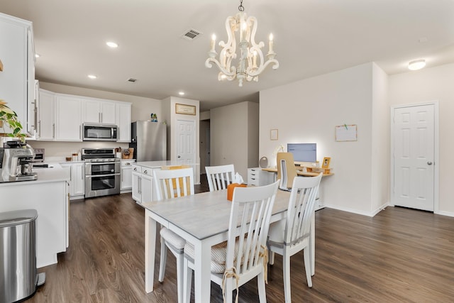 dining space with a chandelier, dark wood-style floors, recessed lighting, and baseboards