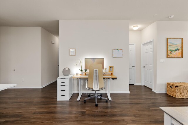 office space with wood finished floors and baseboards