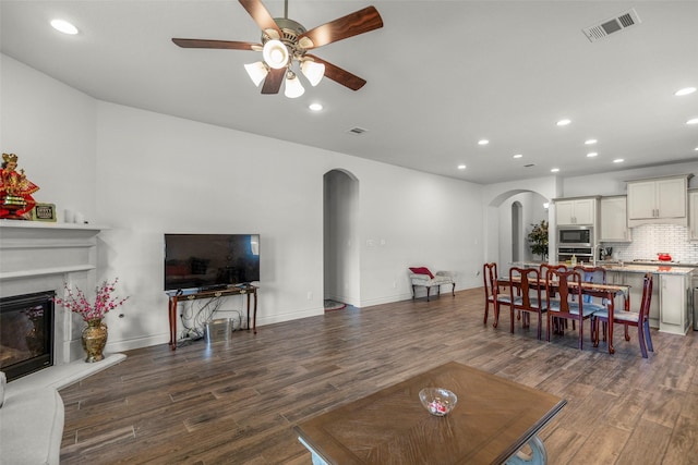 6930 Goldstrum Way, Katy, TX 77493 - living room with recessed lighting, wood finished floors, visible vents, arched walkways, and ceiling fan