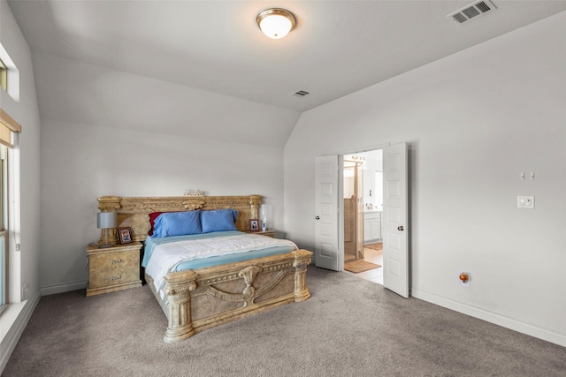 6930 Goldstrum Way, Katy, TX 77493 - bedroom with carpet, visible vents, lofted ceiling, and connected bathroom