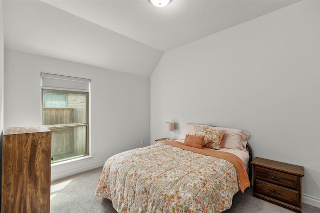 6930 Goldstrum Way, Katy, TX 77493 - carpeted bedroom featuring vaulted ceiling and baseboards