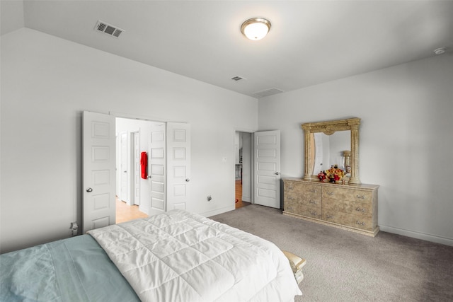6930 Goldstrum Way, Katy, TX 77493 - carpeted bedroom with vaulted ceiling, visible vents, and baseboards