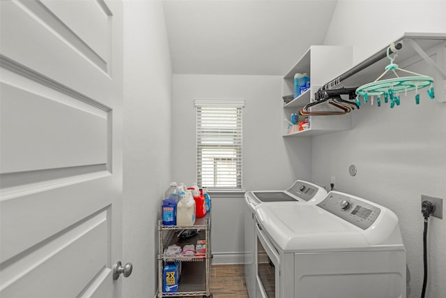 6930 Goldstrum Way, Katy, TX 77493 - washroom featuring washer and dryer, baseboards, dark wood-type flooring, and laundry area