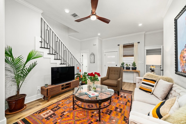 living room with visible vents, recessed lighting, a ceiling fan, wood finished floors, and stairs