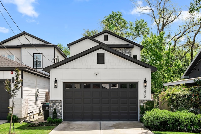 view of front of home with a garage and concrete driveway