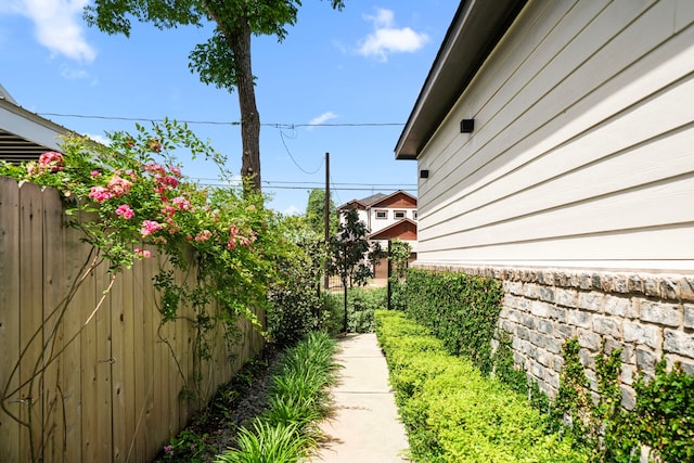 view of side of home with fence