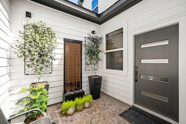 property entrance featuring a patio