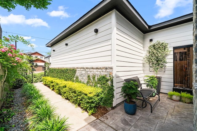 view of side of home featuring a patio