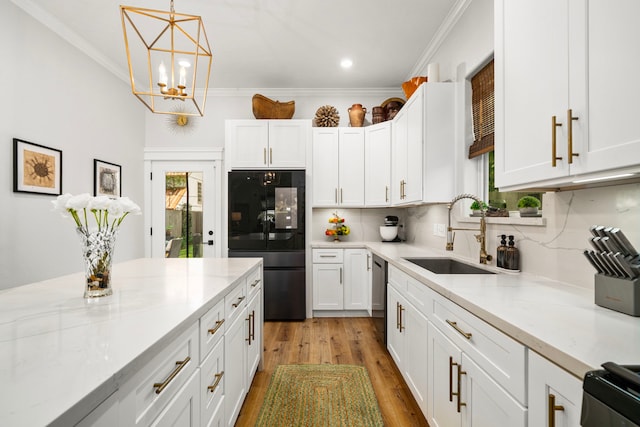 kitchen with a sink, light wood-type flooring, dishwasher, white cabinetry, and refrigerator with glass door