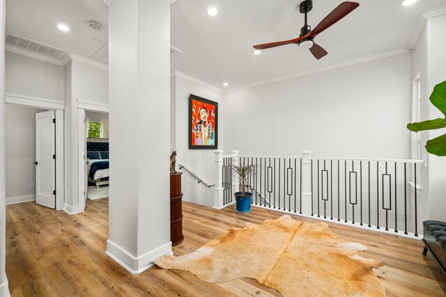 unfurnished room featuring wood finished floors, ceiling fan, ornamental molding, visible vents, and recessed lighting