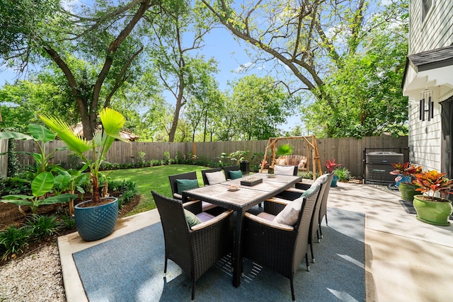 view of patio / terrace with outdoor dining space and a fenced backyard