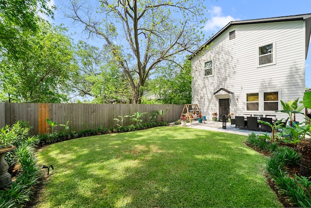 view of yard with a patio and a fenced backyard