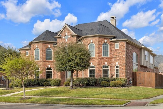 13811 Sugar Dock Ct, Houston, TX 77044 - view of front of property featuring brick siding, a chimney, and roof with shingles