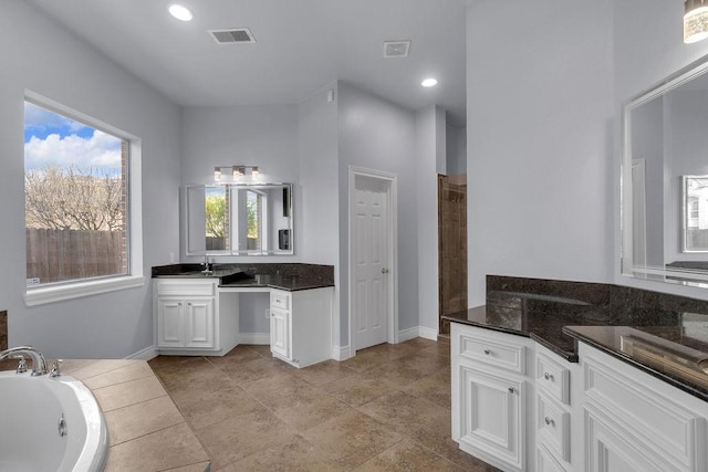 13811 Sugar Dock Ct, Houston, TX 77044 - full bathroom featuring vanity, a tub with jets, recessed lighting, and a tile shower