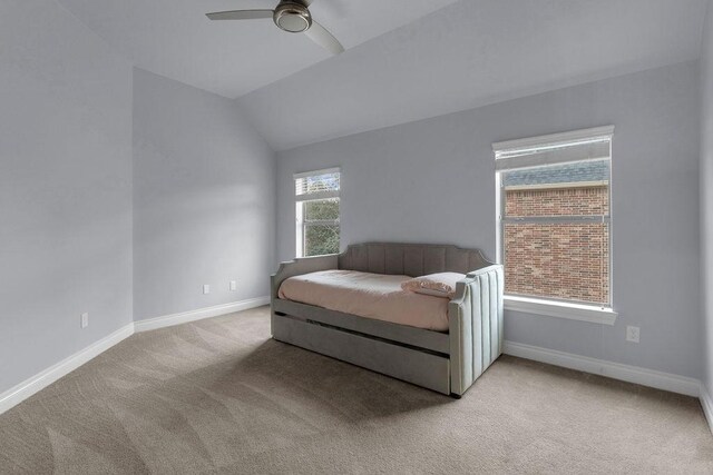 13811 Sugar Dock Ct, Houston, TX 77044 - bedroom featuring light colored carpet, vaulted ceiling, and a ceiling fan