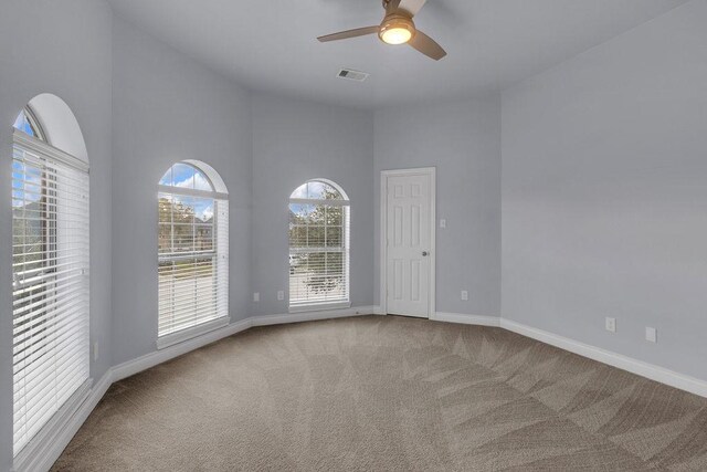 13811 Sugar Dock Ct, Houston, TX 77044 - spare room featuring carpet, a ceiling fan, and a towering ceiling