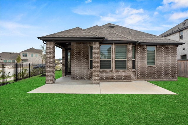 18402 Mesquite Flats Trl, Cypress, TX 77433 - rear view of house featuring brick siding, a patio, and a shingled roof