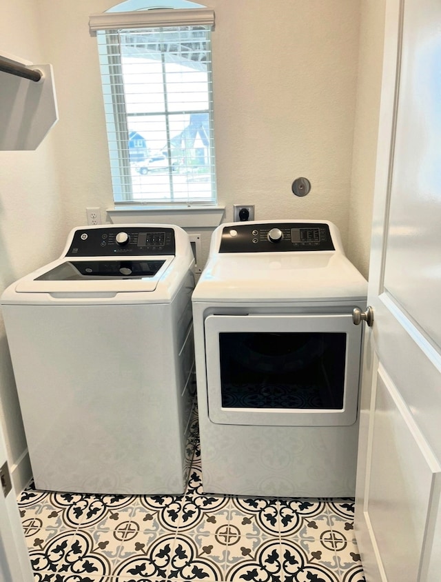 18402 Mesquite Flats Trl, Cypress, TX 77433 - washroom featuring washing machine and clothes dryer and tile patterned floors