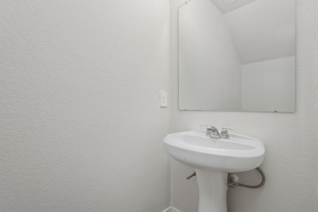 bathroom with vaulted ceiling
