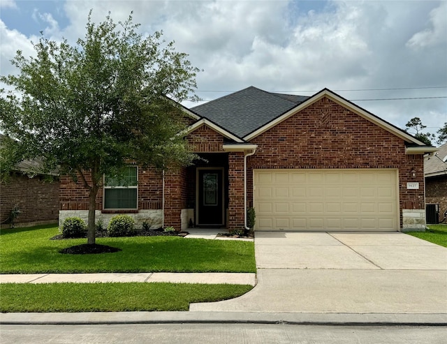 single story home with a front lawn, cooling unit, concrete driveway, brick siding, and an attached garage