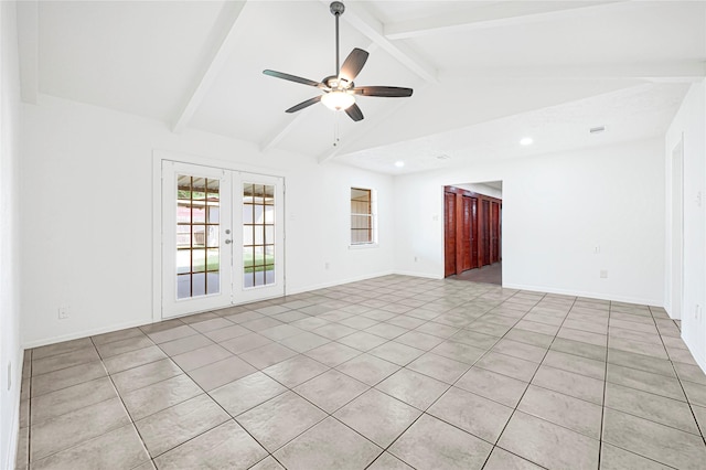 empty room with lofted ceiling with beams, french doors, light tile patterned flooring, baseboards, and a ceiling fan