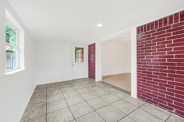 empty room featuring light tile patterned floors and recessed lighting