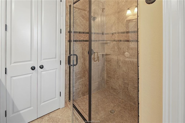 bathroom with a shower stall