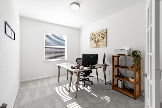 carpeted home office with baseboards
