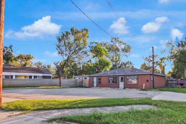 single story home with fence