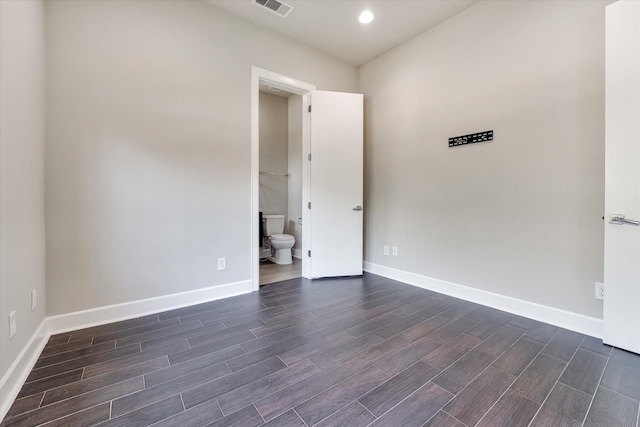 unfurnished room featuring recessed lighting, wood tiled floor, visible vents, and baseboards