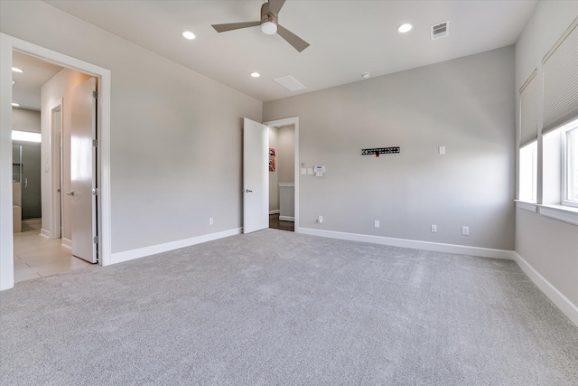 empty room featuring recessed lighting, light carpet, baseboards, and ceiling fan