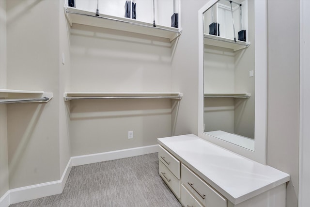 walk in closet featuring carpet floors