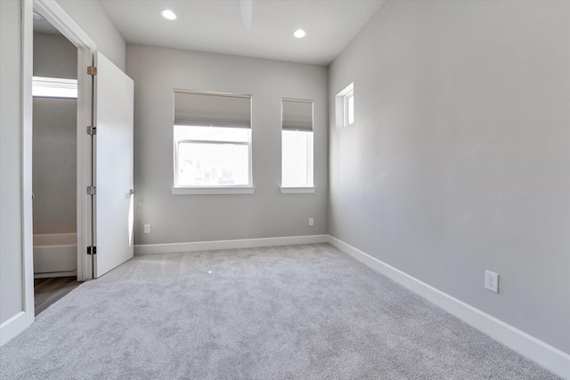 unfurnished bedroom with baseboards, carpet floors, and recessed lighting