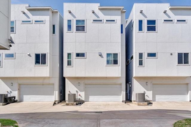 exterior space with stucco siding and a garage
