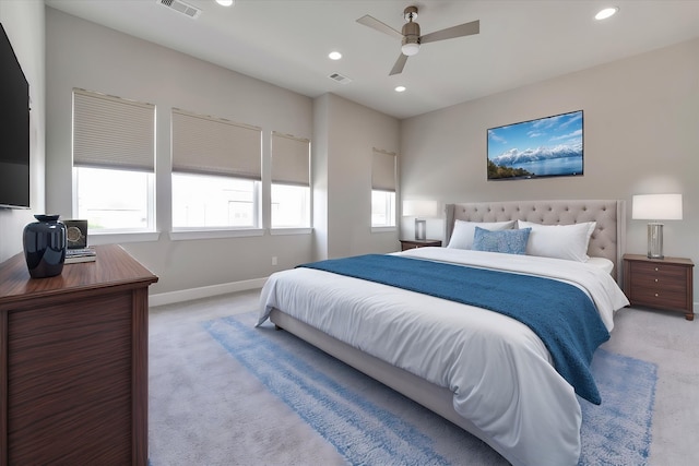 bedroom featuring recessed lighting, light carpet, visible vents, and baseboards