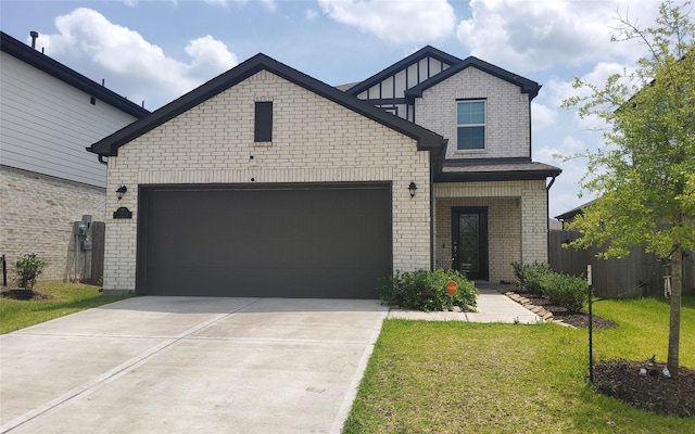 view of front of house featuring brick siding, an attached garage, driveway, and a front lawn