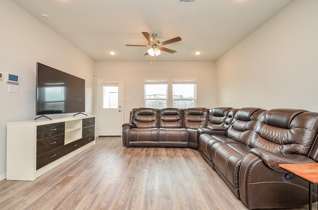 living room featuring recessed lighting, ceiling fan, visible vents, and light wood-style floors