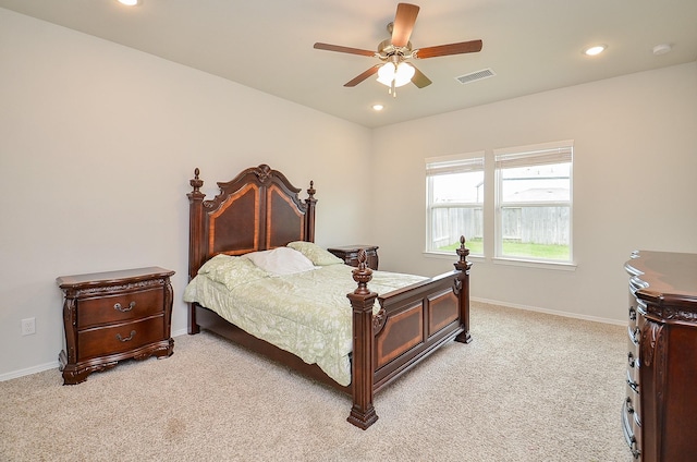 bedroom featuring light carpet, recessed lighting, and visible vents