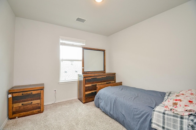 bedroom featuring visible vents, carpet flooring, and baseboards