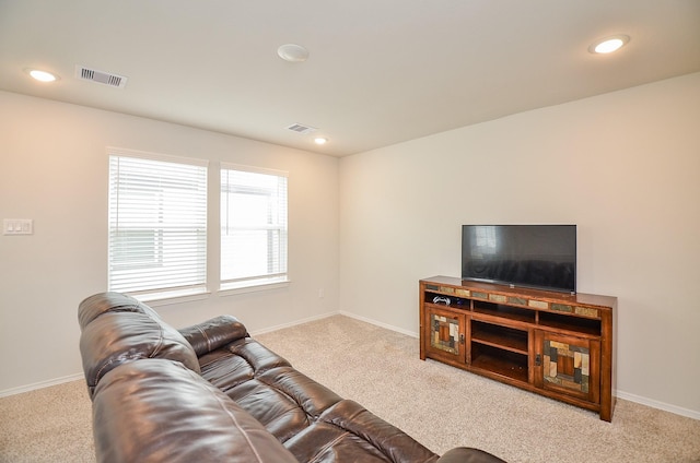 living area with carpet flooring, recessed lighting, and visible vents