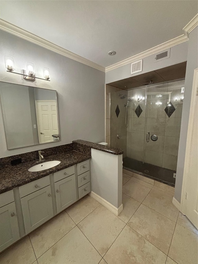 bathroom featuring crown molding, tile patterned floors, vanity, and a shower stall