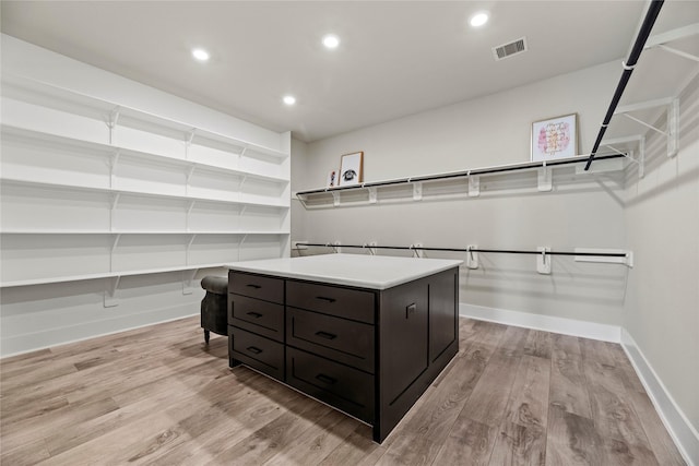 spacious closet with visible vents and light wood-style floors