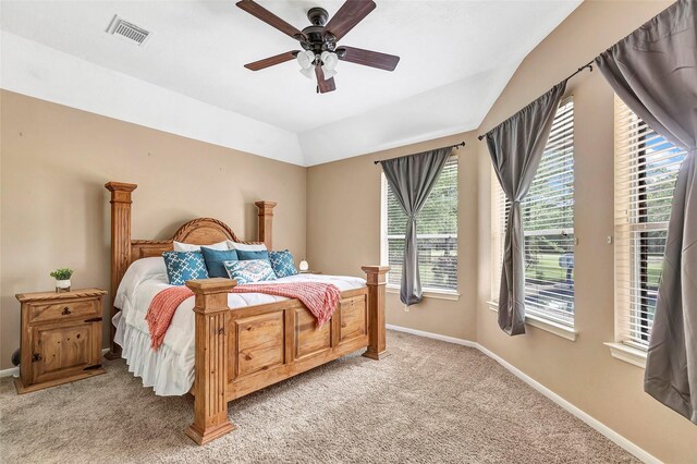 bedroom featuring light carpet, multiple windows, and visible vents