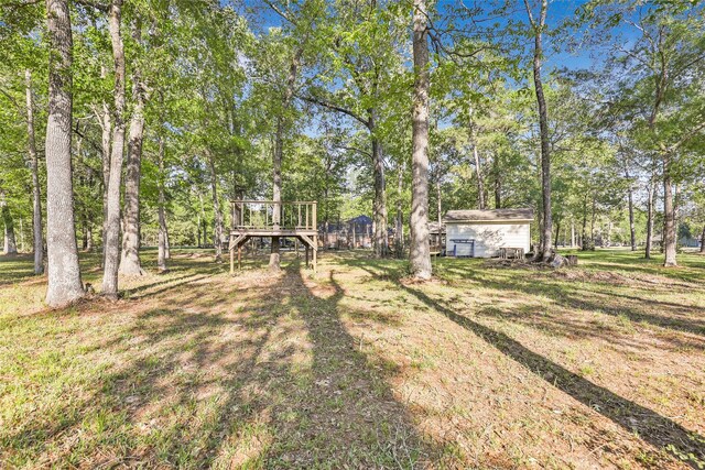 view of yard featuring a wooden deck
