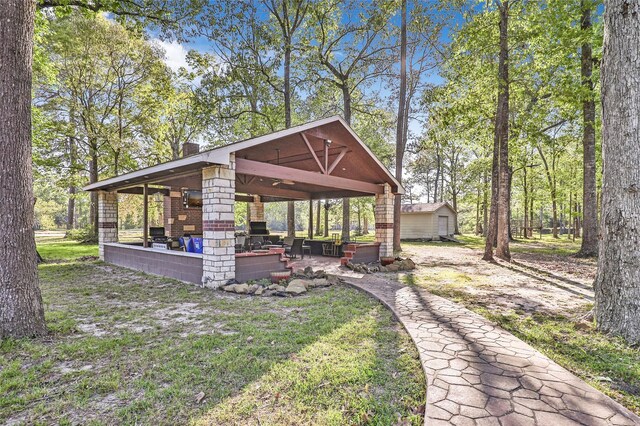 exterior space with a gazebo and an outbuilding