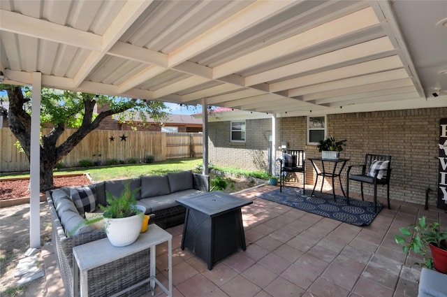 view of patio / terrace with an outdoor living space, a fenced backyard, and outdoor dining space