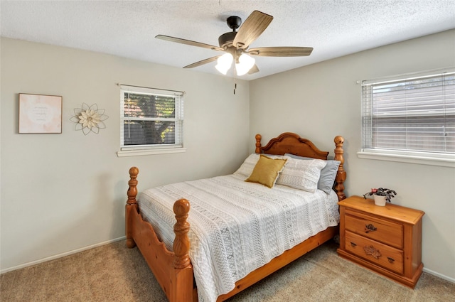bedroom featuring light carpet, baseboards, and multiple windows